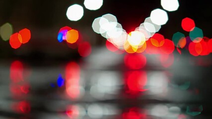 Fototapete - Blurred colorful bokeh lights in blue and red on dark background. Night cityscape concept