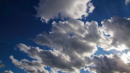 Poster - Dramatic clouds covering blue sky on a sunny day, nature landscape. Weather change concept