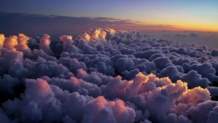Poster - Sunset over fluffy clouds with vibrant hues, aerial view. Dreamy sky imagery concept
