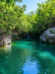 Poster - Serene turquoise water surrounded by lush greenery and rocky formations