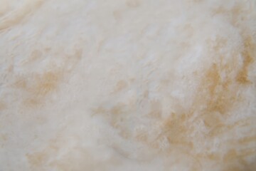 close up view of textured soft fabric in neutral colors