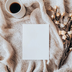 Poster - cozy scene featuring blank postcard, coffee cup, and dried flowers on knitted blanket, evoking warmth and creativity