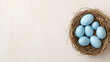 © nuttachet chinavong - nest containing blue eggs, symbolizing new beginnings and nature beauty