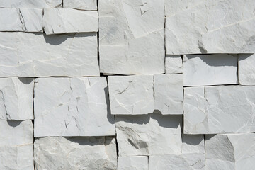 Poster - Close up of stone wall showcasing texture and composition of white blocks