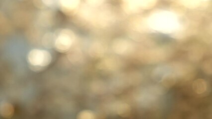 Poster - Soft golden bokeh background with blurred lights creating dreamy atmosphere of tranquility.