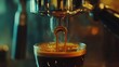 © Cucoo - Espresso pouring into a small glass cup. Steam rising.