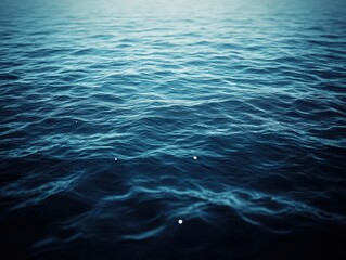 Poster - Serene Blue Waves of Ocean Water Rippled Under Gentle Light, Creating a Peaceful and Tranquil Seascape for Relaxing Nature Backgrounds