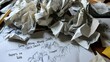 © Abdul - Creative Chaos in the Studio: Discarded Drafts and Crumpled Sketches on a Table Surrounded by Artistic Tools and Inspiration for Future Designs