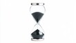 © Oleg - Elegant Sand Hourglass on White Background: Time, Minimalism, and Elegance in Modern Decor