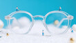 © Shivani - A giant pair of glasses with tiny workers polishing the lenses and adjusting the frame screws.