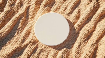 Poster - Minimalist white circular podium on textured sand surface for product display