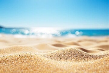 Aufkleber - Close-up of sand on a beach with ocean in the background.