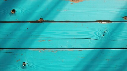Poster - Aqua-colored weathered wooden planks with sun-dappled shadows showing signs of age and texture