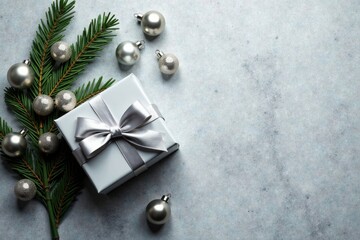 Aufkleber - A Festive Gift Box with Silver Ornaments and Evergreen Sprig on a Textured Surface