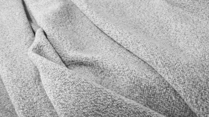 Fototapete - A piece of fabric with a wrinkled texture. The fabric is gray and has a fuzzy appearance