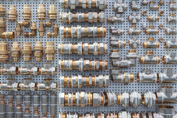 Aufkleber - A wall of pipes and fittings with a variety of sizes and shapes. The wall is organized and the pipes are displayed in a way that makes it easy to see the differences between them