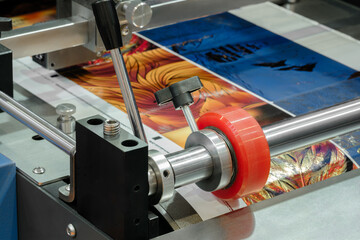 Poster - A machine is printing a colorful image on a piece of paper.  machine is using a special type of ink to create the image