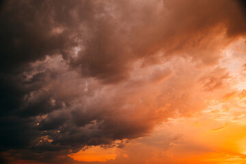 Wall Mural - Sunset Cloudy Sky With Fluffy Clouds. Sunset Sky in pink orange colors Background. Dramatic Sky. sunrise Sunset In Yellow, Orange, Pink Colors