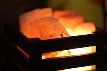 Poster - A close-up shot of a lit candle inside a decorative box.
