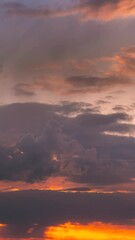 Wall Mural - Sunset Cloudy Sky With Fluffy Clouds. Sunset Sky Natural Background. Dramatic Sky. Sunset Time Lapse Time-Lapse In Yellow, Orange, Pink Colors. Day To Night Transition. Cloudy Sky With Fluffy Clouds