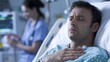 © Олег Чуприна - Man in hospital bed experiencing chest discomfort with medical staff in the background providing assistance