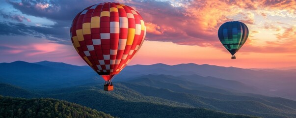 Wall Mural - two hot air balloons flying over the Smoky Mountains. One balloon is red and yellow with a white checkered pattern