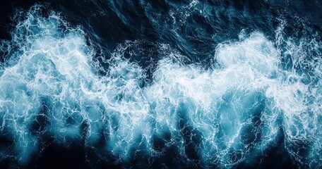 Poster - Beautiful High Angle View of Turbulent Ocean Waves with Deep Blue Tones and White Foam Pattern, Natural Water Surface in Motion Captured from Above