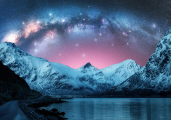 Wall Mural - milky way arch above fjord and snowy mountains on starry winter night. lofoten islands, norway. pano