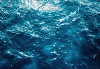 Poster - Tranquil Waves of Bright Blue Ocean Water with Sunlight Reflections Captured from Above in a Serene Coastal Environment