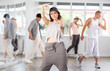 © JackF - Plastic young lady engaged in breakdance against background of others performing dance pose in row