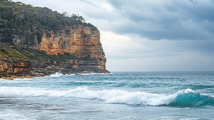 Aufkleber - A stunning view of a rocky coastline with clear blue ocean waves crashing against the shore, symbolizing natureâ€™s raw beauty and the power of the sea.