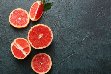Wall Mural - cut fresh grapefruit on dark background
