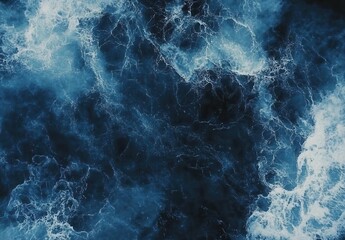 Poster - Deep Blue Ocean Waves with White Foam Crests Captured from Above, Showing Turbulent Water Textures and Movement in Vivid Detail for Nature Lovers and Artists