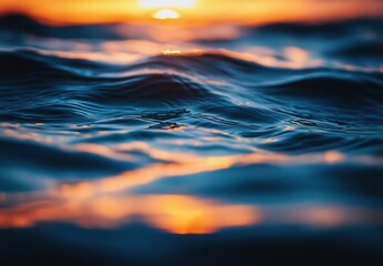Poster - Tranquil Ocean Waves Reflecting Warm Sunset Hues Over the Water Surface in Vibrant Shades of Blue and Orange During Golden Hour at Dusk