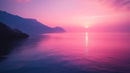 Wall Mural - the sun sets over a calm body of water and mountains