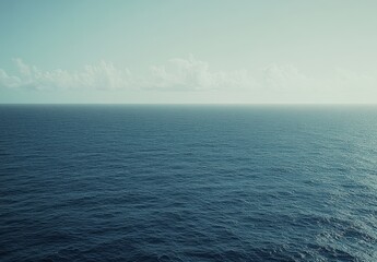 Poster - Calm serene ocean view with gentle waves and distant horizon under a clear sky with soft clouds, evoking tranquility and peace for relaxation or travel themes