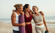© (JLco) Julia Amaral - Three women enjoying yoga and friendship by the beach at sunset
