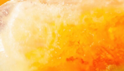 Poster - macro shot of frozen orange and yellow citrus fruit slice with icy texture, abstract vibrant background for food concepts

