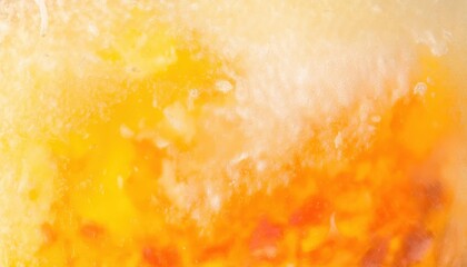 Poster - macro shot of frozen orange and yellow citrus fruit slice with icy texture, abstract vibrant background for food concepts

