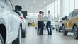 © t.sableaux - Couple reviews purchase documents with sales manager in a bright, upscale dealership interior