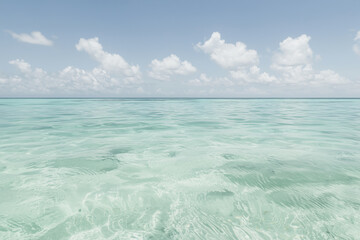 Poster - serene ocean view with distant horizon and scattered clouds