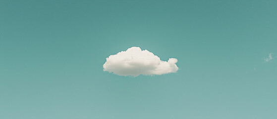 Poster - single fluffy cloud floats in clear blue sky, creating serene scene
