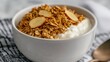 © Aleksandra - Bowl of granola with yogurt and raspberries, copy space.