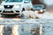 © Denis - Cars navigate through flooded streets on a rainy day in an urban area, creating splashes as they drive by