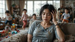 © Elio - Overwhelmed young asian mother in a chaotic home environment