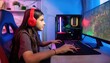 © Marko - A teenage girl wearing red and black gaming headphones, sitting in front of a computer screen with RGB lights
