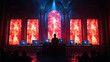 © Peen - DJ performs in dramatic setting with fiery red screens and ornate architecture, creating intense atmosphere. audience is silhouetted against vibrant backdrop, enhancing concert energy