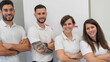 © jovannig - Friendly physiotherapy team standing together in a modern medical office