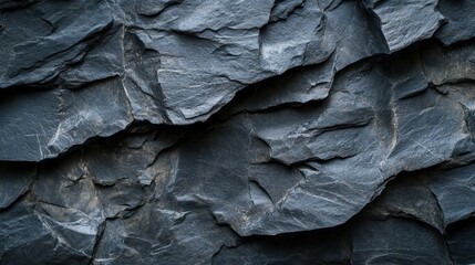 Poster - Dramatic dark slate stone texture background showcasing rugged rock formations and natural patterns ideal for backgrounds and design elements with a geological aesthetic