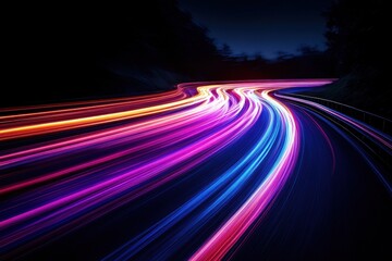 Poster - Dynamic light trails illuminate winding road at night creating vibrant streaks of color and motion for futuristic concept